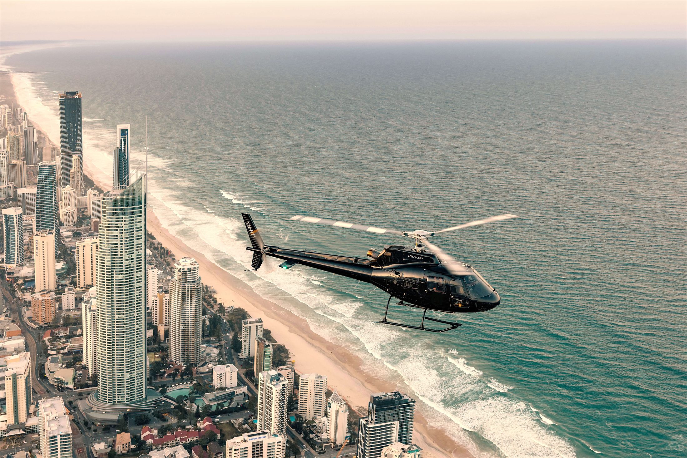 Gold Coast Helitours helicopter cruising the coastline
